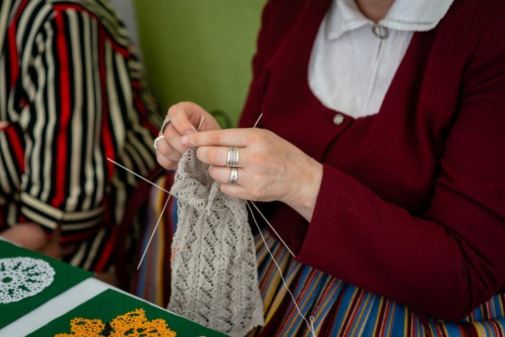 Elderly Woman Knitting with Wool